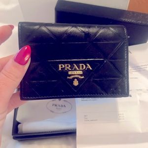 Authentic Prada wallet . Black calf skin.